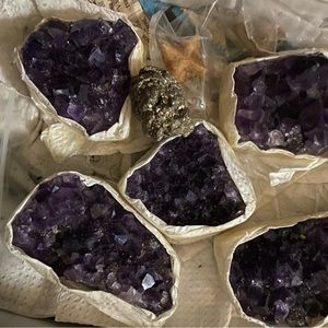 Wholesale box of amethyst clusters